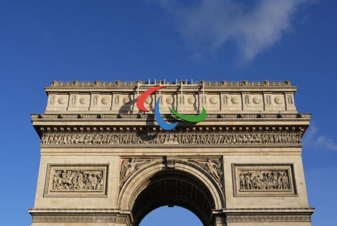 The Paralympic symbol, known as Agitos, installed atop the French Arc de Triomphe monument in Paris